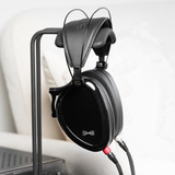 Dan Clark Audio NOIRE X Closed Back Planar Headphones | On Headphone Stand with Cable Thumbnail